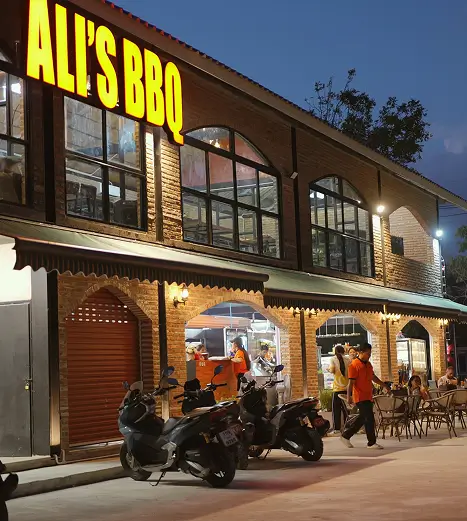 Ali's BBQ storefront at night on Soi Ta-iad, Chalong
